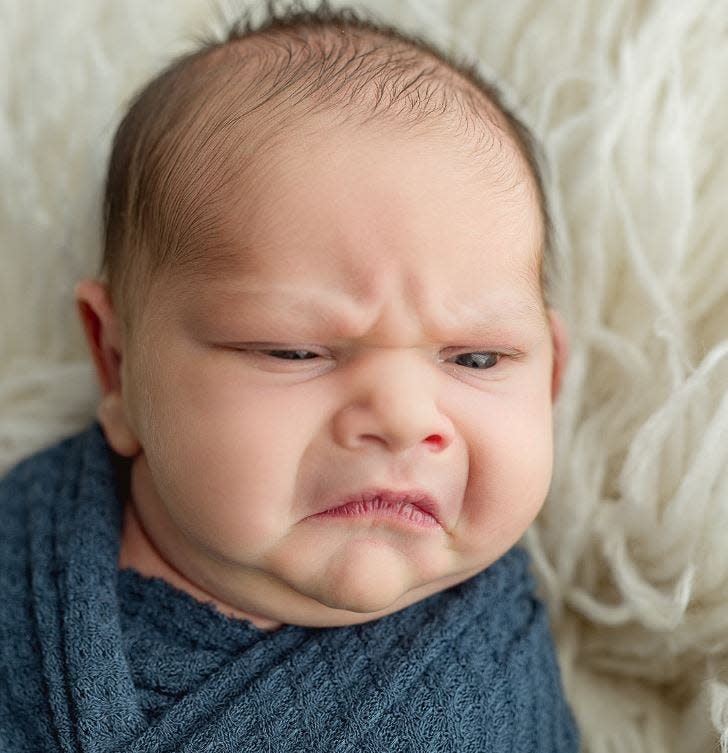 This newborn's express has gone viral, with many flocking to Laruen Carson's Facebook page to get a look at all of the "grumpy" baby pics.