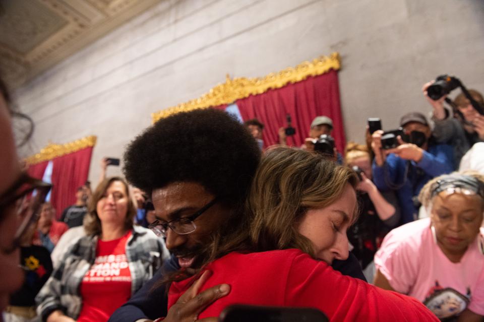 Justin Pearson, D-Memphis hugs Sarah Neumann, whose child is a student at the Covenant School, in the gallery of the House of Representatives at the Tennessee State Capitol in Nashville, Tenn., on Thursday, April 6, 2023. GOP representatives are expected to vote on expelling him along with Democratic representatives Justin Jones of Nashville and Gloria Johnson of Knoxville.