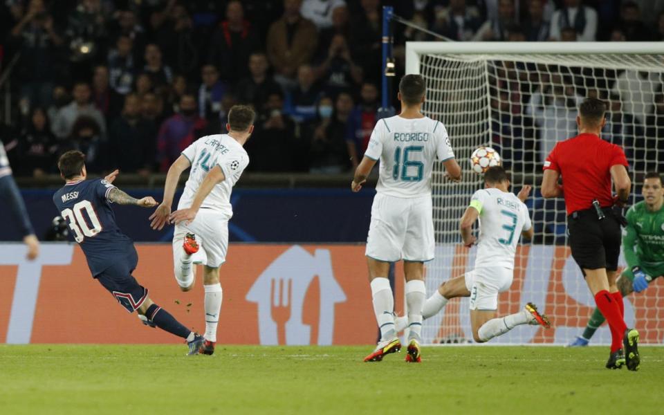 Paris Saint Germain's Lionel Messi (L) scores a goal during the UEFA Champions League group A soccer match between PSG and Manchester City at the Parc des Princes stadium - YOAN VALAT/EPA-EFE/Shutterstock