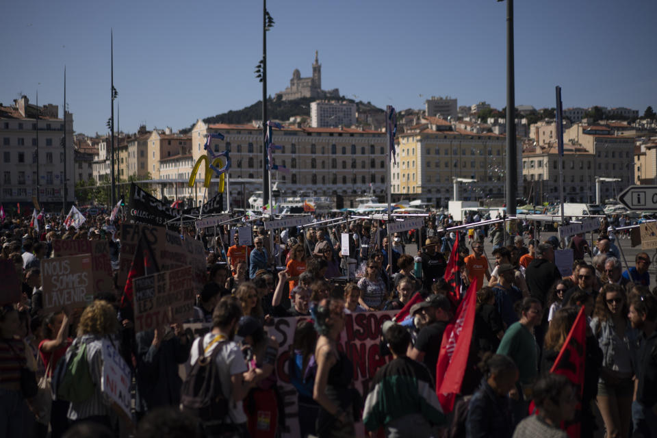 Protesters march during a May Day demonstration in Marseille, southern France, Sunday, May 1, 2022. May 1 is celebrated as the International Labour Day or May Day across the world. (AP Photo/Daniel Cole)