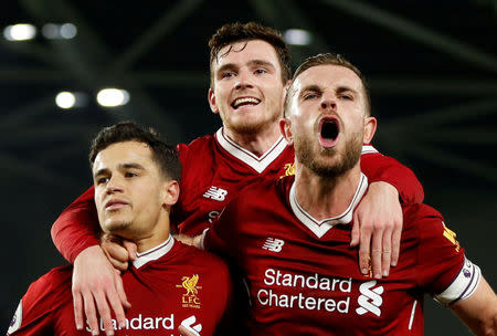 Soccer Football - Premier League - Brighton & Hove Albion vs Liverpool - The American Express Community Stadium, Brighton, Britain - December 2, 2017 Liverpool's Philippe Coutinho celebrates scoring their fourth goal with Jordan Henderson (R) and Andrew Robertson (C) Action Images via Reuters/John Sibley