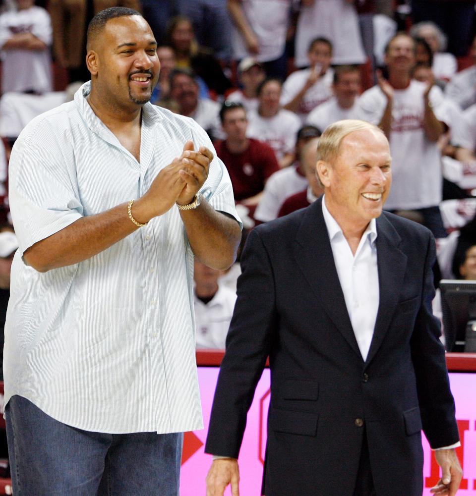 Former OU player Stacey King, left, and former OU basketball coach Billy Tubbs smile during a tribute to the 1988 Oklahoma men's basketball team at halftime of a March 1, 2008 game between Oklahoma and Texas A&M at the Lloyd Noble Center in Norman, Oklahoma.