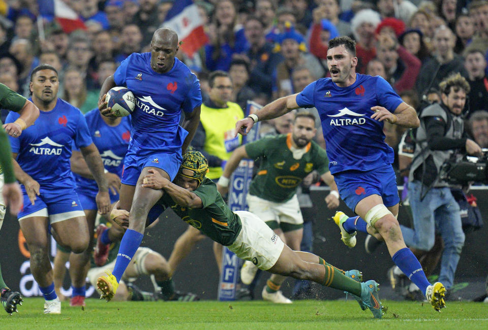 FILE - France's Sekou Macalou is tackled by South Africa's Kurt-Lee Ardense during the rugby union international between France and South Africa in Marseille, France, Saturday, Nov. 12, 2022. (AP Photo/Daniel Cole, File)