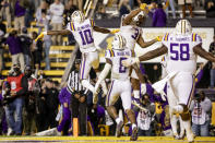 LSU wide receiver Jaray Jenkins (10) and running back Tyrion Davis-Price (3) celebrate after a touchdown against Texas A&M during the fourth quarter of an NCAA college football game in Baton Rouge, La., Saturday, Nov. 27, 2021. (AP Photo/Derick Hingle)