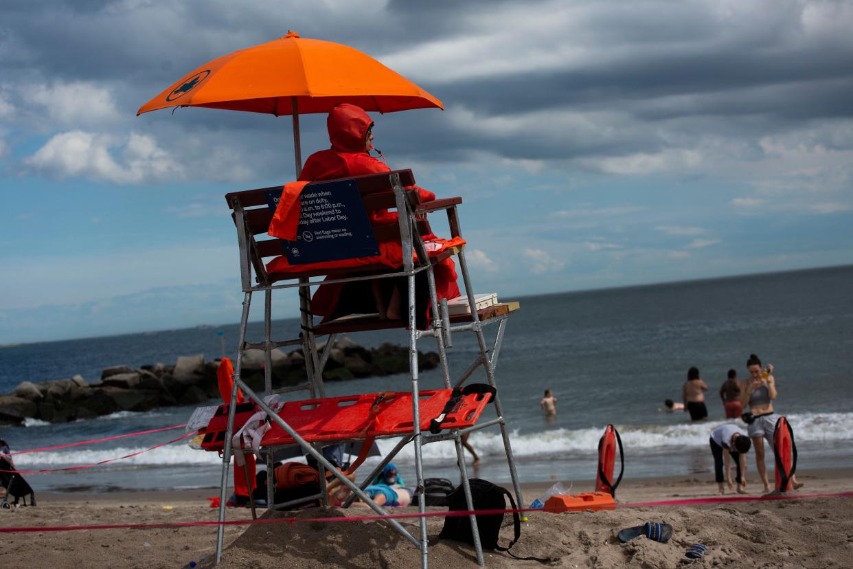 A lifeguard looks on as people visit Coney Island in Brooklyn, New York City on May 28, 2022.