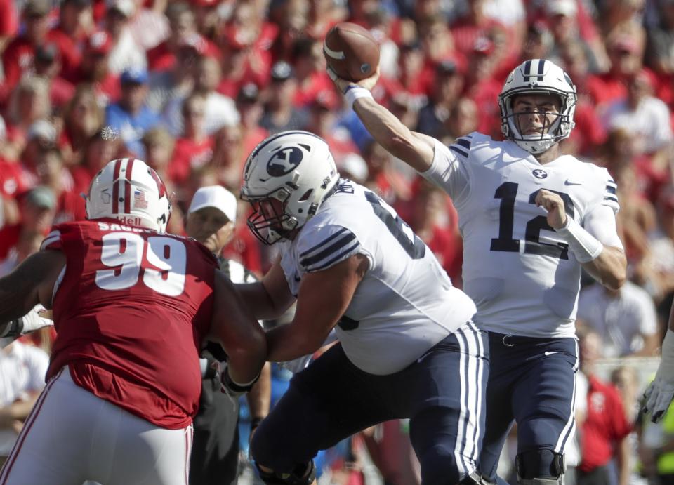 BYU quarterback Tanner Mangum throws during the first half of an NCAA college football game against Wisconsin Saturday, Sept. 15, 2018, in Madison, Wis. (AP Photo/Morry Gash)
