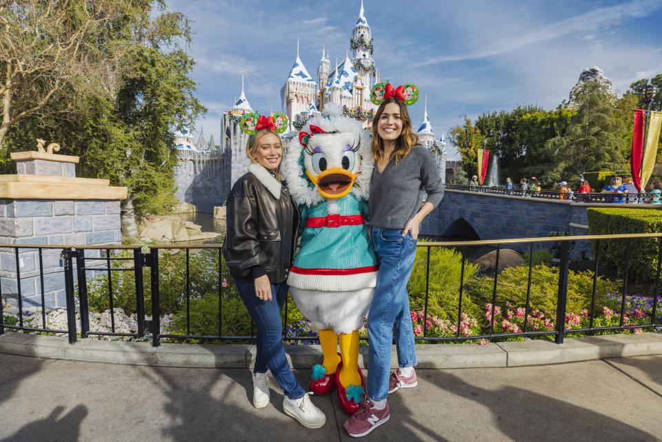 Hilary Duff and Mandy Moore visit Sleeping Beauty's Winter Castle on December 11, 2023 at Disneyland in Anaheim, California. (Photo by Christian Thompson/Disneyland Resort via Getty Images)