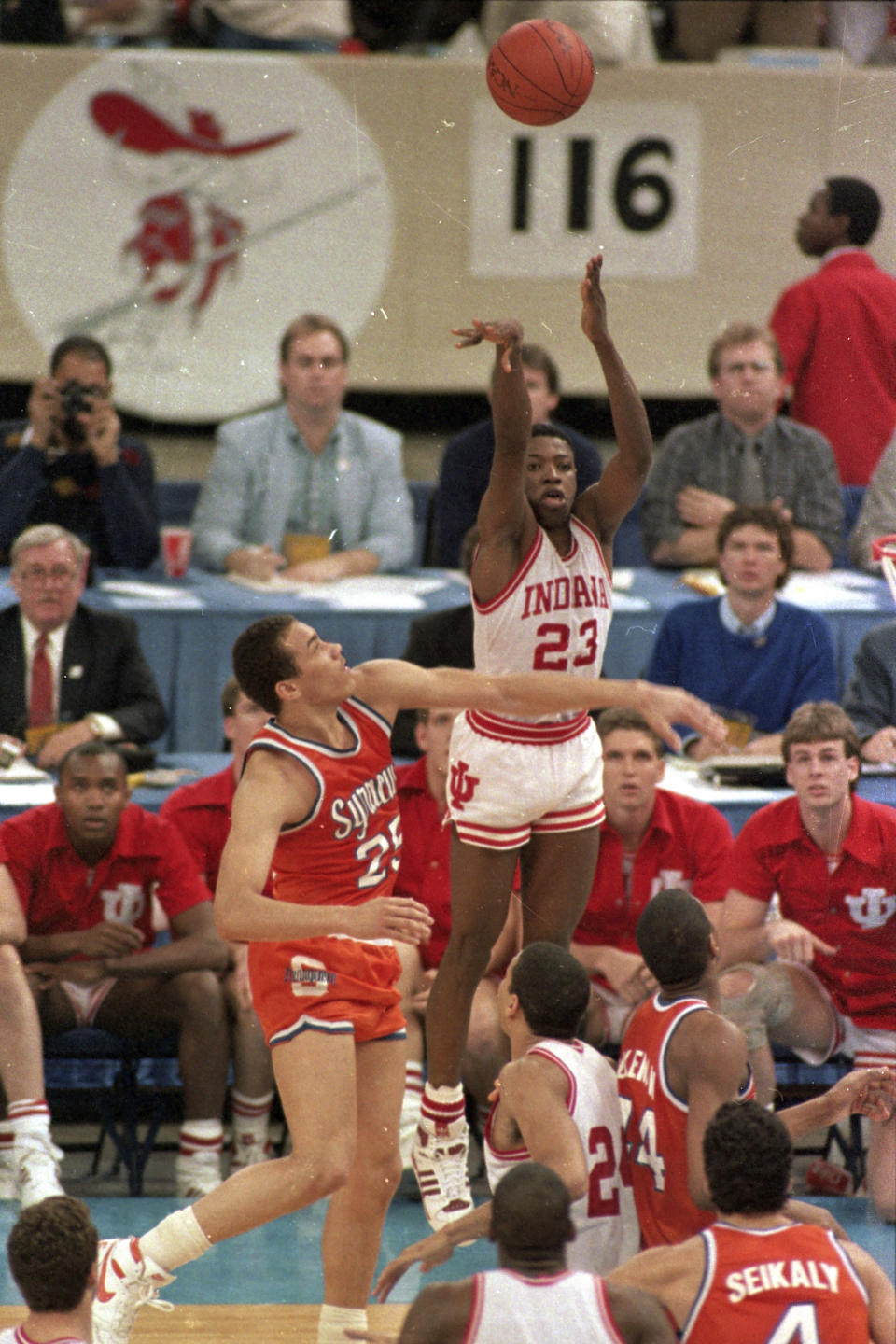 FILE - Indiana's Keith Smart (23) fires a shot past Syracuse's Howard Triche for a basket, putting Indiana ahead by one point in the final seconds of the NCAA college basketball championship game, March 30, 1987, in New Orleans. Indiana defeated Syracuse 74-73. Smart hit the winning shot in the 1987 NCAA title game for Indiana against Syracuse. (AP Photo/Bill Haber, File)