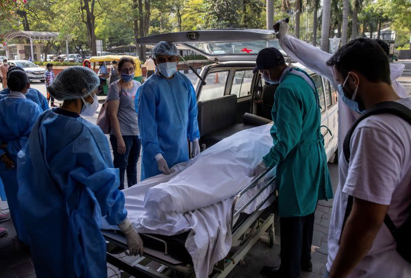 The Wider Image: As COVID ravages India, a 26-year-old doctor decides who lives and who dies