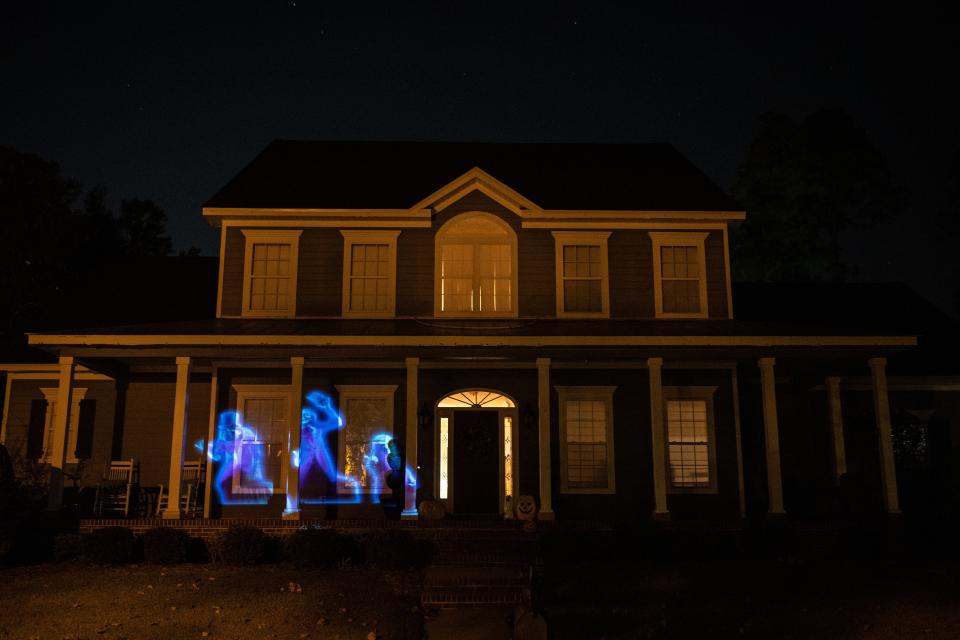 A series of Halloween themed projections are displayed on Carl Fuqua’s Southwood home Friday, Oct. 21, 2022.