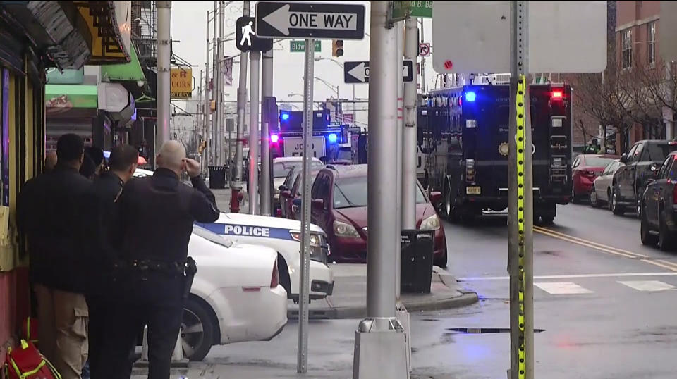 Police officers respond following reports of gunfire on Tuesday. (Photo: ASSOCIATED PRESS)