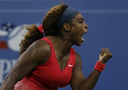 Serena Williams of the U.S. celebrates a point against Azarenka of Belarus during their women's singles final match at the U.S. Open tennis championships in New York