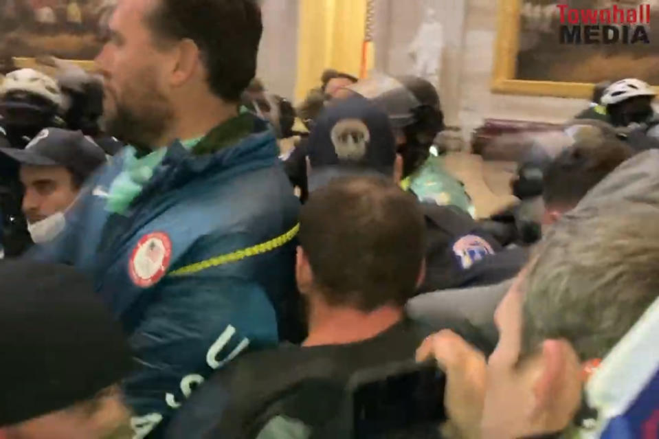 A screenshot from a video uploaded by Townhall Media that was cited in the criminal complaint filed by federal officials. The video shows at multiple times what appears to be Klete Keller, wearing his Olympic USA jacket, inside the Capitol on Jan. 6. 