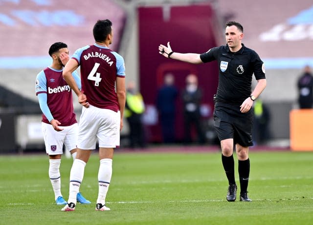 Referee Chris Kavanagh (right) sends off Fabian Balbuena