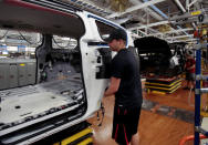 An FCA assembly worker works on the frame of the all-new 2017 Chrysler Pacifica minivan at the FCA Windsor Assembly plant in Windsor, Ontario May 6, 2016. REUTERS/Rebecca Cook