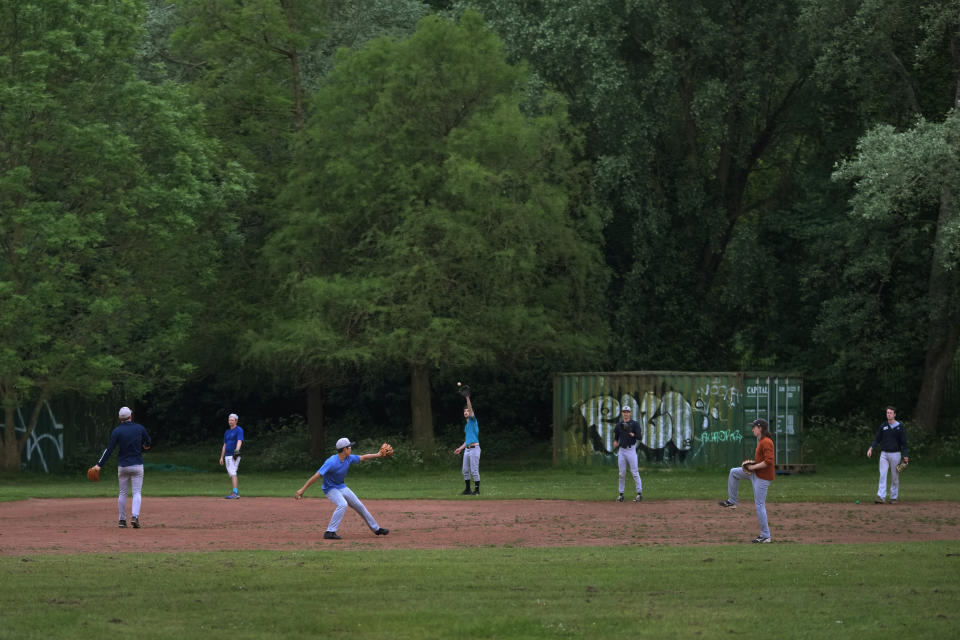 Members of the UK baseball team London Mets practice during a training session at the Finsbury Park in London, Thursday, May 16, 2024. Baseball at the highest club level in Britain is competitive. Teams are mélange of locals and expats some with college and minor league experience. (AP Photo/Kin Cheung)