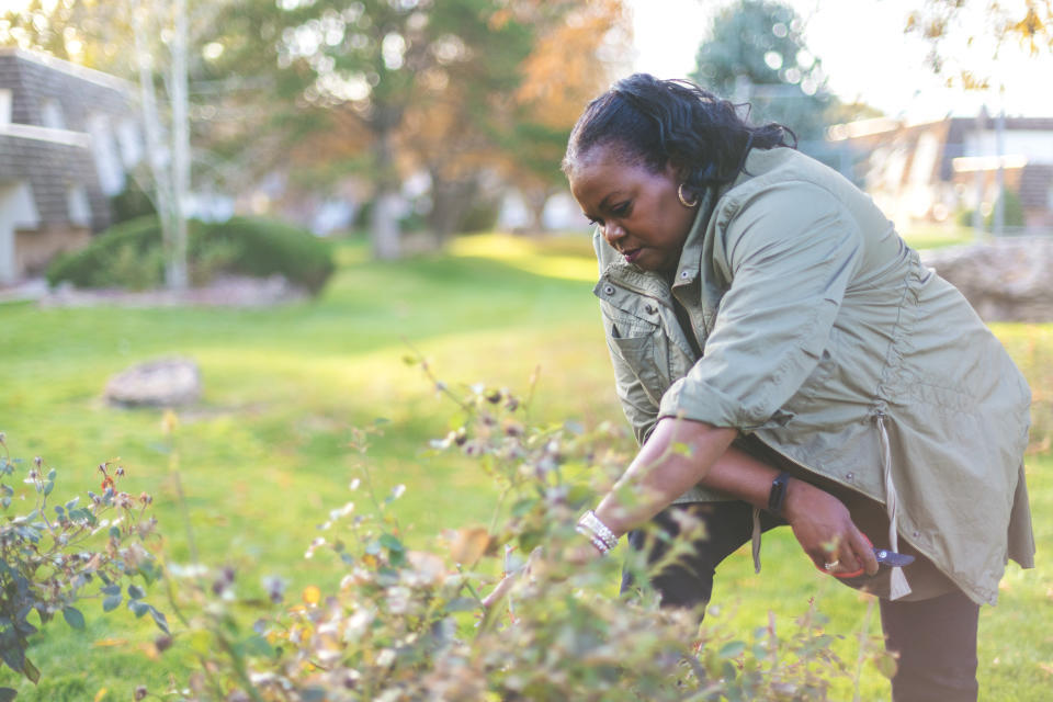Woman gardening outdoors. (Getty Images)