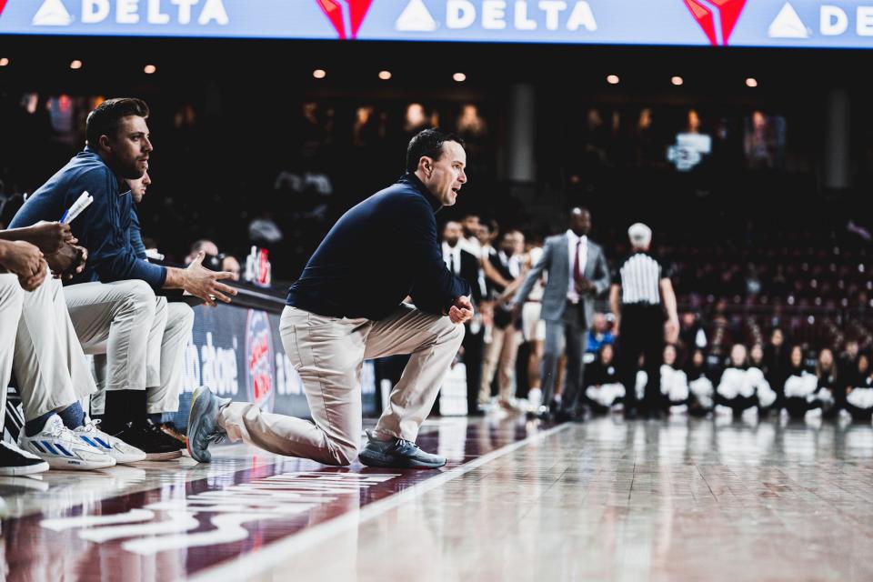 URI men's head basketball coach Archie Miller on the sideline during a game last season at Boston College.