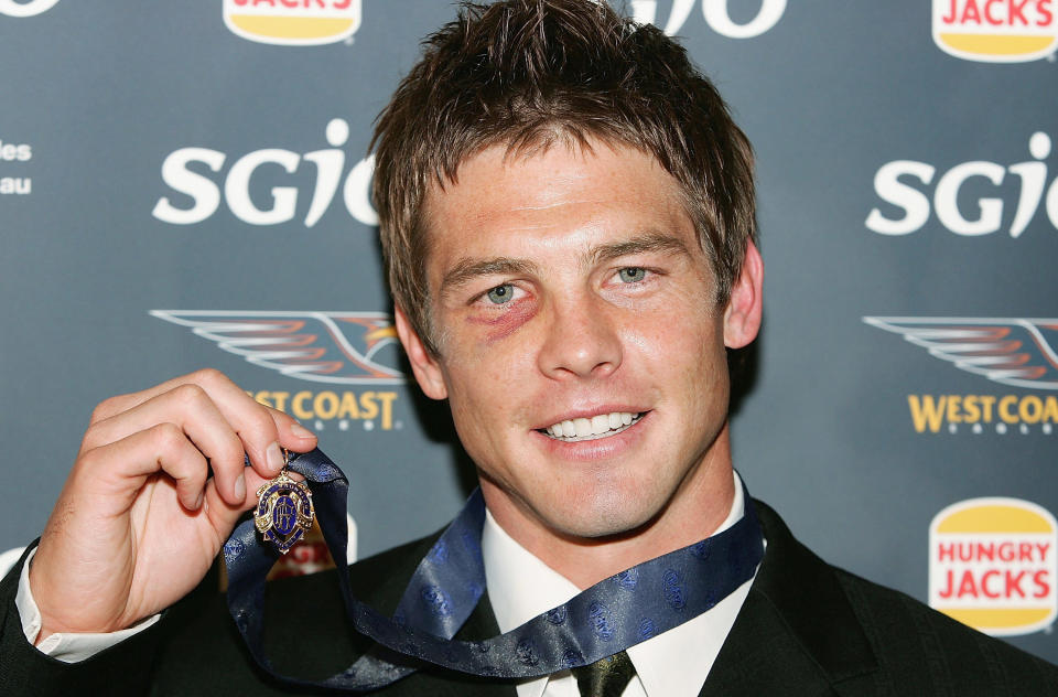 PERTH, AUSTRALIA - SEPTEMBER 19:  Ben Cousins of the Eagles poses with the 2005 Brownlow Medal after being announced as the winner during the West Coast Eagles Brownlow Medal Dinner at the Burswood Casino September 19, 2005 in Perth, Australia.(Photo by Paul Kane/Getty Images)