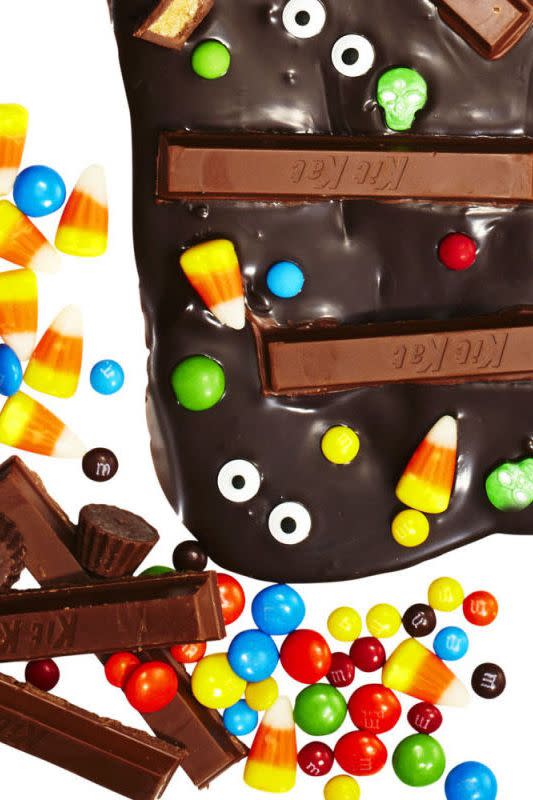 <p>You have to dump all of that leftover candy somewhere, so why not pour some in a layer of melted chocolate? </p><p>Get the <a href="https://www.goodhousekeeping.com/holidays/halloween-ideas/a34763/halloween-chocolate-candy-bark/" rel="nofollow noopener" target="_blank" data-ylk="slk:Halloween Candy Bark recipe;elm:context_link;itc:0;sec:content-canvas" class="link "><strong>Halloween Candy Bark recipe</strong></a>.<br></p>