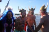 <p>Participants are seen in the water during a polar bear plunge at the beach in Coney Island, Brooklyn on Jan. 1, 2018. New Yorkers took part in new year’s day swim with temperature standing at -7 degrees Celsius. (Photo: Atilgan Ozdil/Anadolu Agency/Getty Images) </p>