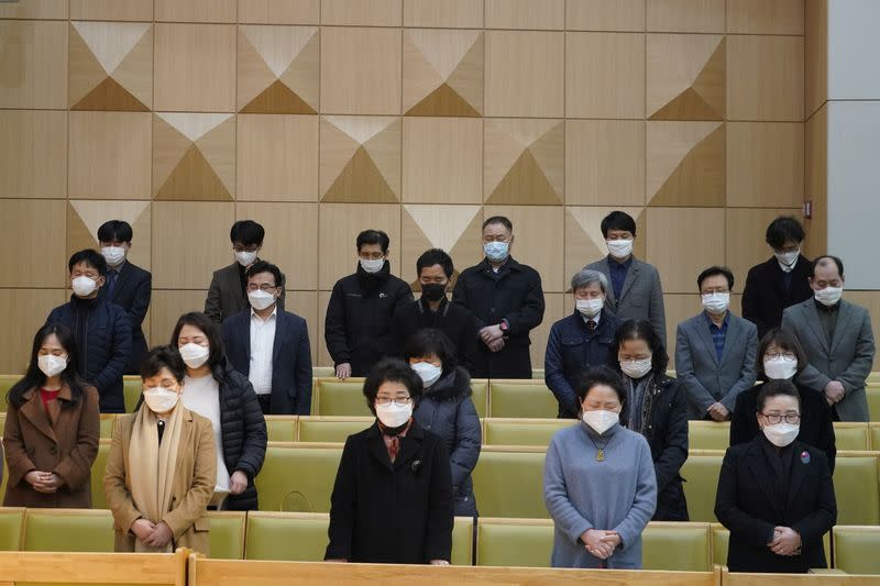 Christian faithful wearing masks to prevent contacting coronavirus pray during a service in Seoul