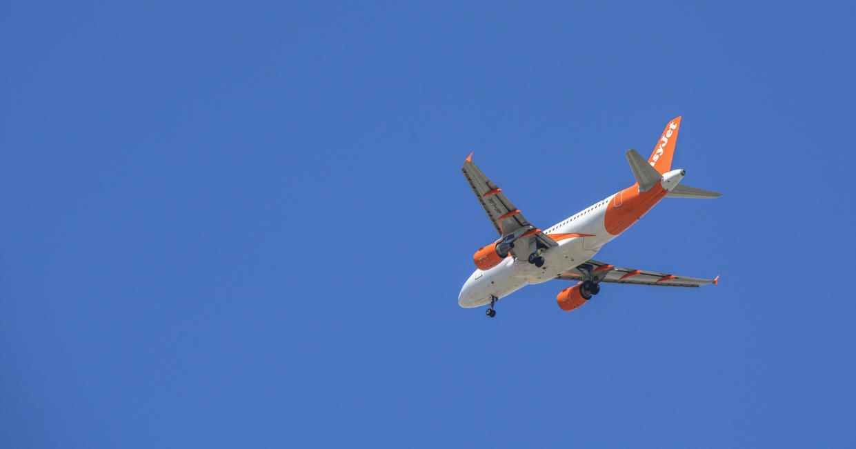 A mother wearing a sheer top without a bra was removed from an Easy Jet flight when she allegedly became "disruptive." 