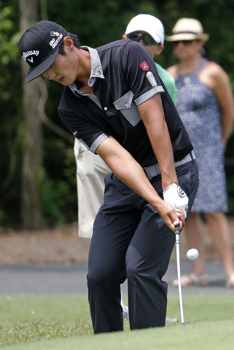 Danny Lee chips onto the first green during the final round of the Zurich Classic golf tournament at TPC Louisiana in Avondale, La., Sunday, April 27, 2014. (AP Photo/Bill Haber)