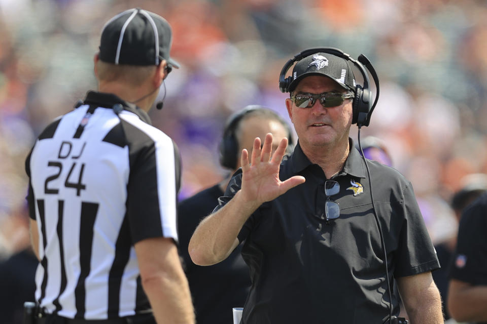 Minnesota Vikings head coach Mike Zimmer talks with an official in the first half of an NFL football game against the Cincinnati Bengals, Sunday, Sept. 12, 2021, in Cincinnati. (AP Photo/Aaron Doster)