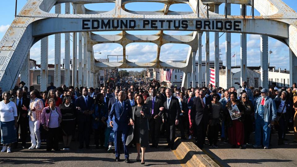 PHOTO: Vice President Kamala Harris walks with Al Sharpton as she joins a march across the Edmund Pettus Bridge to commemorate the 59th anniversary of 'Bloody Sunday' in Selma, AL, Mar. 3, 2024.  (Saul Loeb/AFP via Getty Images)