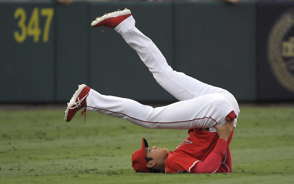 Los Angeles Angels' Shohei Ohtani, of Japan, stretches prior to the team's baseball game against the Oakland Athletics on Saturday, Aug. 11, 2018, in Anaheim, Calif. (AP Photo/Mark J. Terrill)