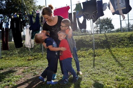 Katarzyna Ichnowska poses with her children in Nowa Karczma