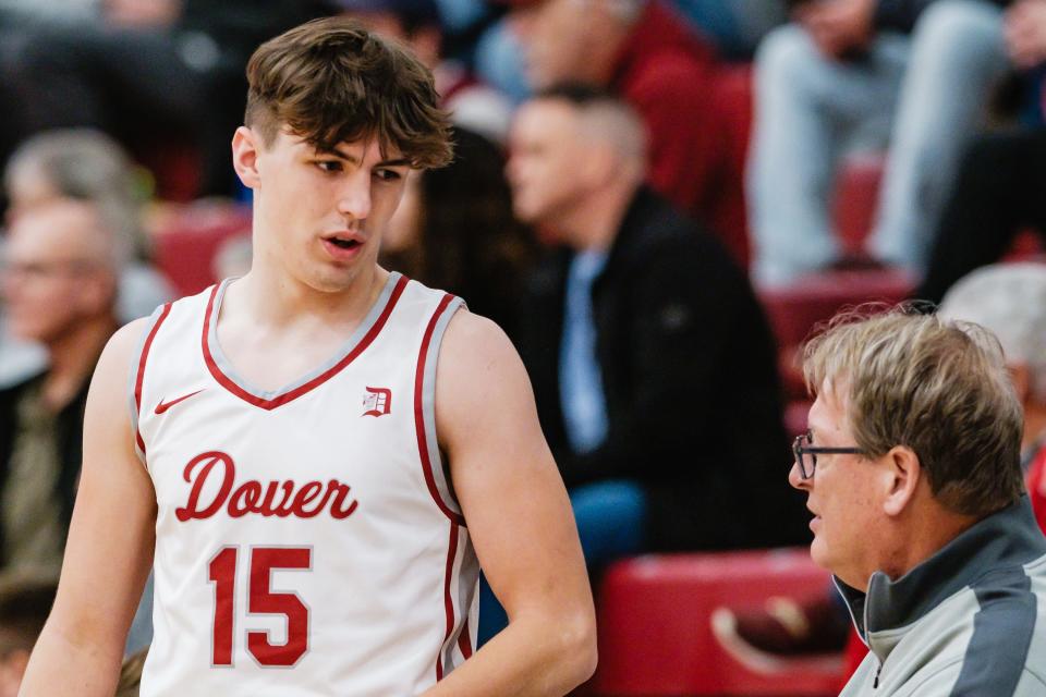 Dover's J.J. Barton chats with head coach Bob Von Kaenel, right, during a 2023 Holiday Shootout game against Dalton in December. Von Kaenel hasn't had a losing season in 33 years of coaching the Crimson Tornadoes.