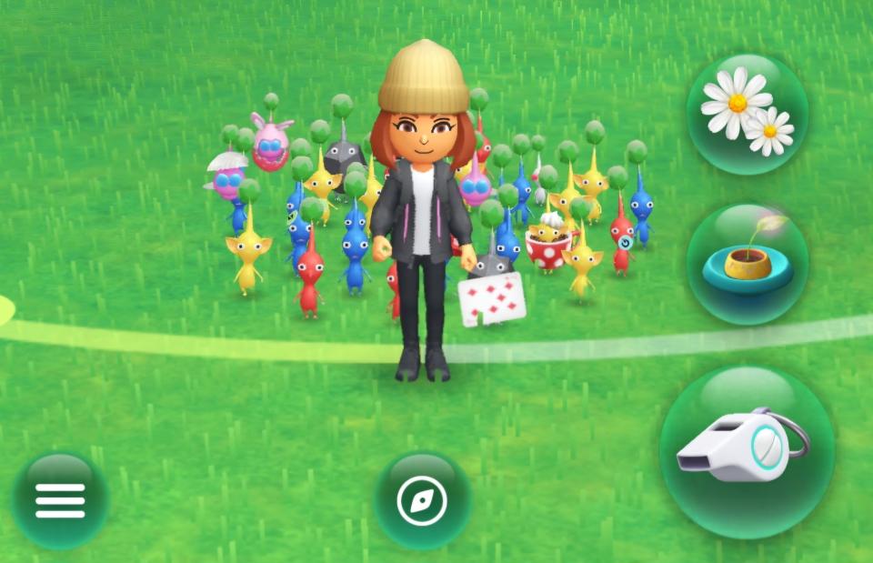 The author's Mii is depicted in a screenshot from Pikmin Bloom, standing around a group of Pikmin.