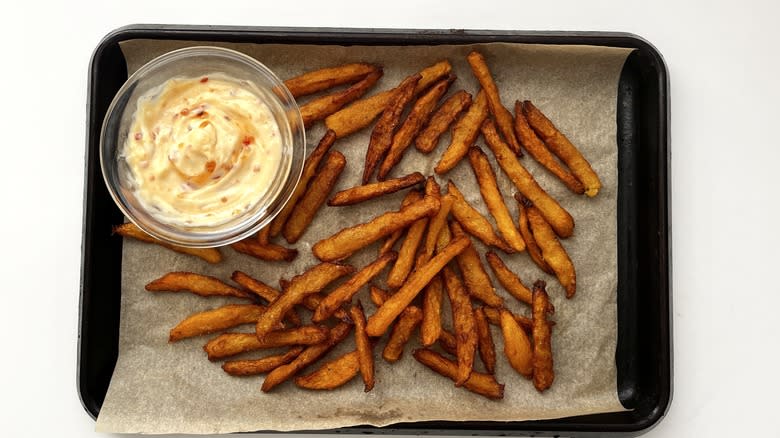 rutabaga fries with mayonnaise sauce on tray