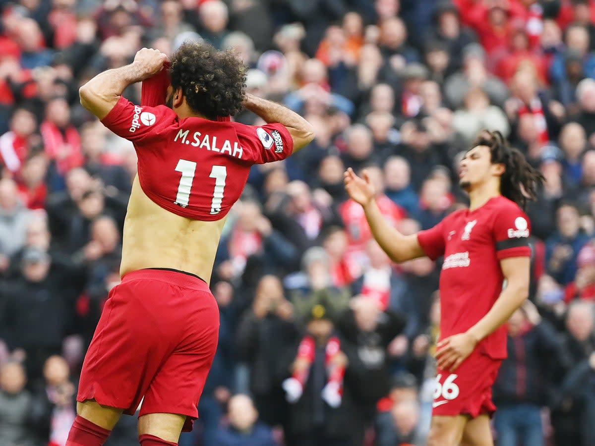 Mohamed Salah (left) missed a penalty as Liverpool came back from 2-0 down to draw with Arsenal  (Getty Images)