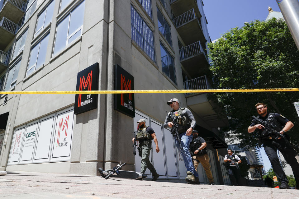 Law enforcement officers arrive near the scene of an active shooter on Wednesday, May 3, 2023 in Atlanta. Atlanta police said there had been no additional shots fired since the initial shooting unfolded inside a building in a commercial area with many office towers and high-rise apartments. (AP Photo/Alex Slitz)