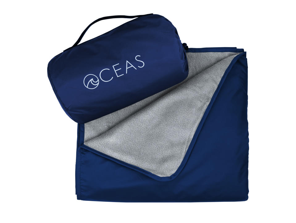 This image shows the Oceas Waterproof Blanket that comes with a carry pouch. (Oceas via AP)