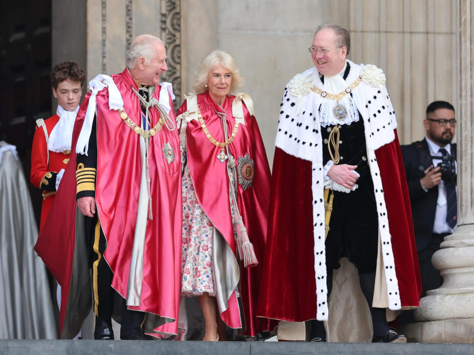 King Charles III shares a joke with Lord Mayor, Alderman Professor Michael Mainelli as he and Queen Camilla depart a service of dedication for the Order of The British Empire