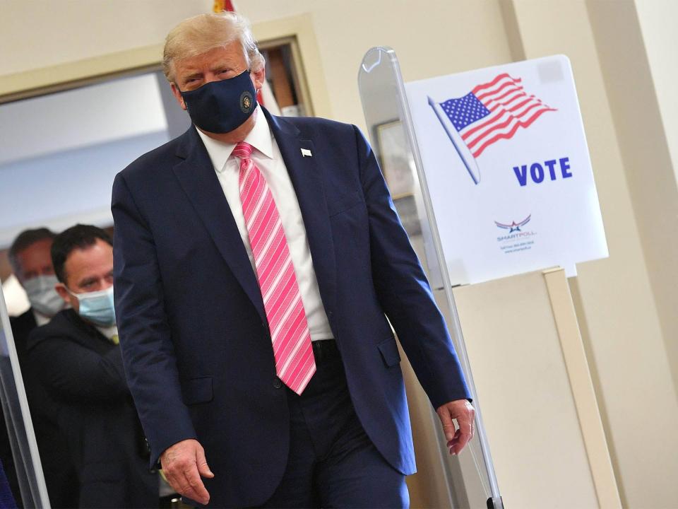 President Donald Trump leaves after casting his ballot at the Palm Beach County Public Library, during early voting for the 3 November election (AFP via Getty Images)