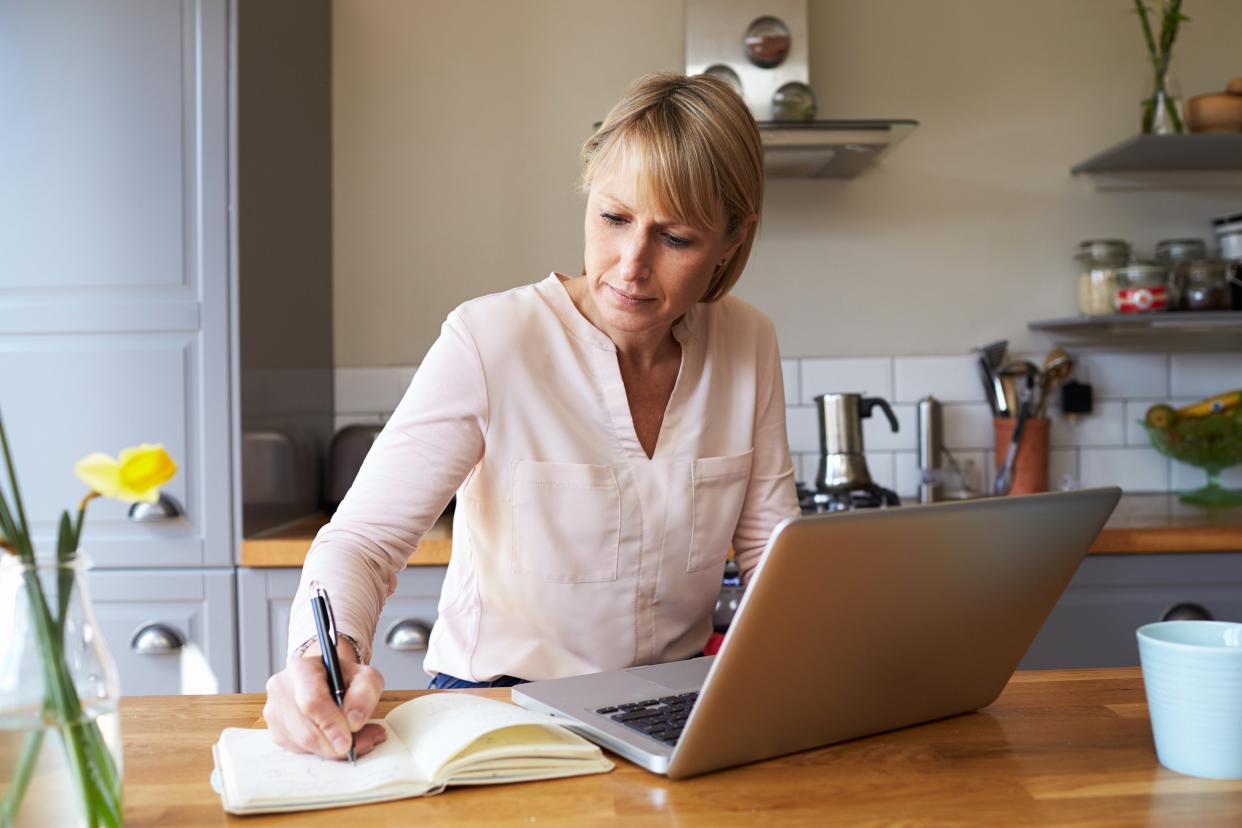 woman working from home on laptop in modern apartment