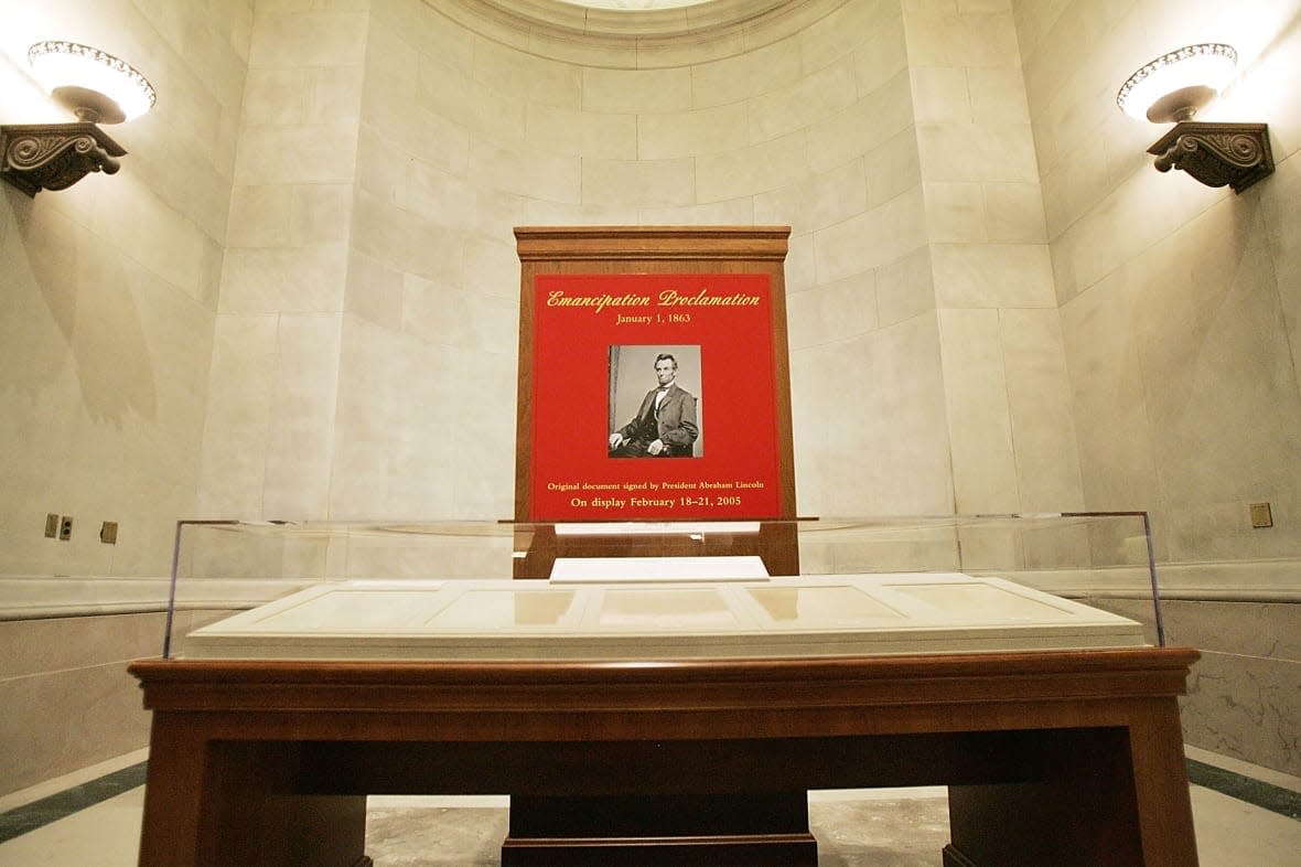 An exhibit of U.S. President Abraham Lincoln’s Emancipation Proclamation is shown at the National Archives Building February 18, 2005 in Washington, DC. The document will go on a limited display, due to the poor quality of the paper and ink on the final draft that makes it vulnerable to light, as part of Black History Month. (Photo by Mark Wilson/Getty Images)