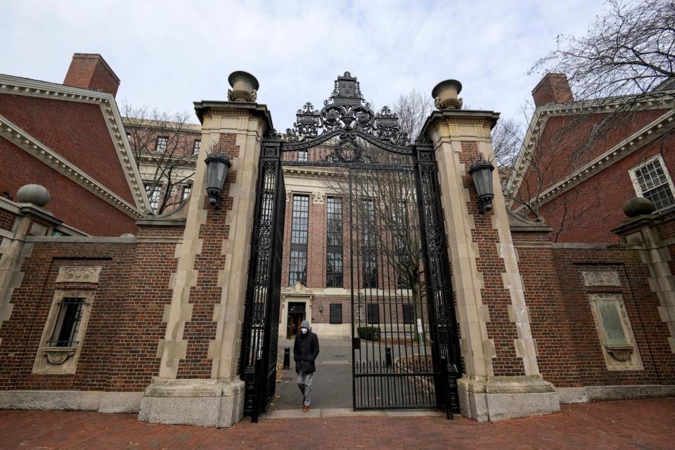 PHOTO: An unidentified person walks through Harvard yard at Harvard University in Cambridge, Mass., Dec. 7, 2023. (Faith Ninivaggi/Reuters, FILE)