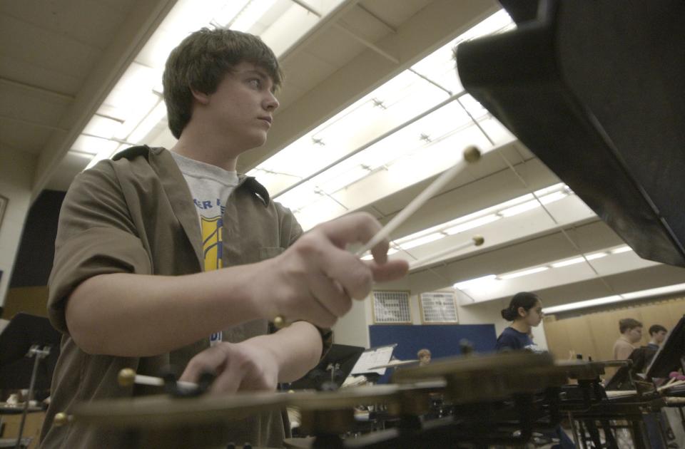 Jordan Morrison, 16, practices with the Lancaster High School Percussion Ensemble, inside the high school, in Lancaster, Ohio, on Monday, April 12, 2004. The group will travel to San Francisco for a concert.