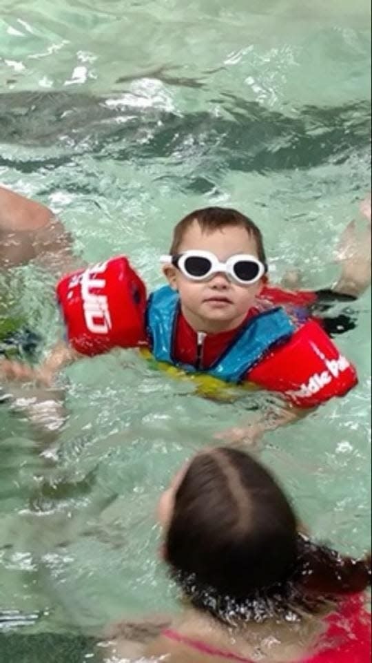 "Super" Cooper Busch enjoys a swim in the pool.