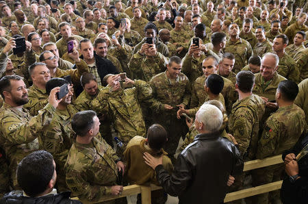 U.S. Vice President Mike Pence poses for photos with troops after addressing them in a hangar at Bagram Air Field in Afghanistan on December 21, 2017. REUTERS/Mandel Ngan/Pool