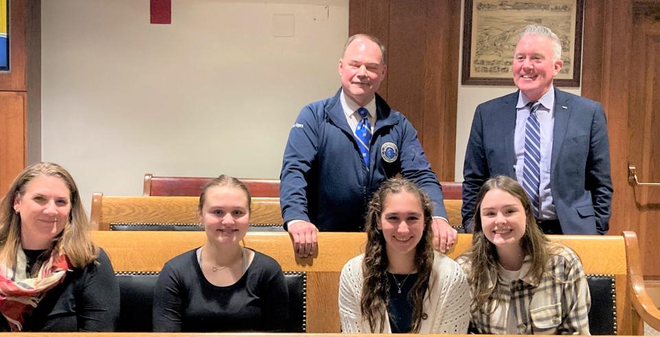 Jennifer Orlinski, left, chair of the Norwood High School social studies department, accompanied three of her students to the Statehouse: Addie Cataldo, 16, Haido Bratsis, 17 and Delilah Sayers. They were also supported by Rep. John Rogers, D-Norwood, at right.