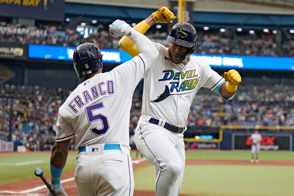 Tampa Bay Rays' Jose Siri, right, celebrates with on-deck batter Wander Franco after Siri hit a solo home run off Detroit Tigers starting pitcher Eduardo Rodriguez during the third inning at Tropicana Field in St. Petersburg, Florida, on Thursday, March 30, 2023.