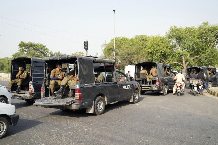 Police officers patrol around the home of Pakistan's former Prime Minister Imran Khan, in Lahore, Pakistan, Wednesday, May 17, 2023. Police surrounded the home of Pakistan's former Prime Minister Khan on Wednesday, claiming he was sheltering dozens of people allegedly involved in violent protests over his recent detention. (AP Photo/K.M. Chaudary)