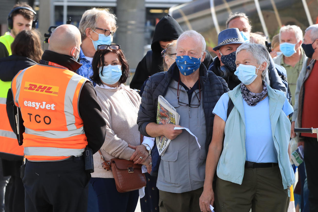 Passengers prepare to board an easyJet flight to Faro, Portugal, at Gatwick Airport in West Sussex after the ban on international leisure travel for people in England was lifted following the further easing of lockdown restrictions. Picture date: Monday May 17, 2021.